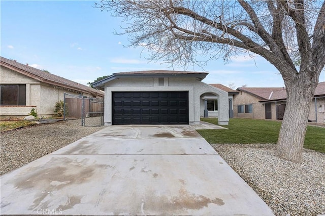 ranch-style house featuring a front yard and a garage