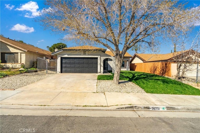 ranch-style house with driveway, an attached garage, fence, a front lawn, and stucco siding