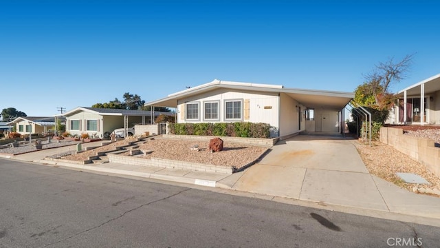 manufactured / mobile home featuring a carport