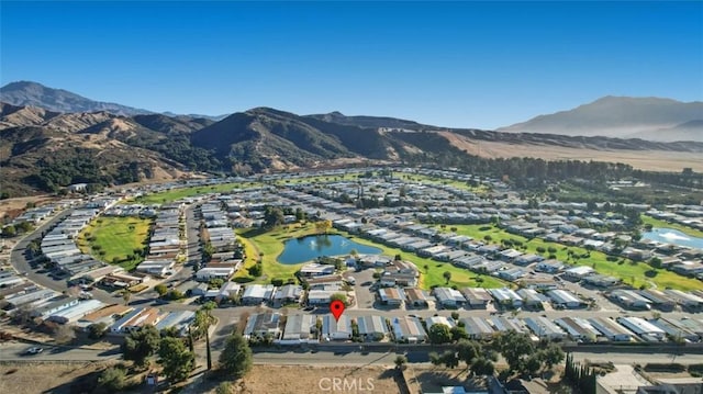 aerial view featuring a water and mountain view