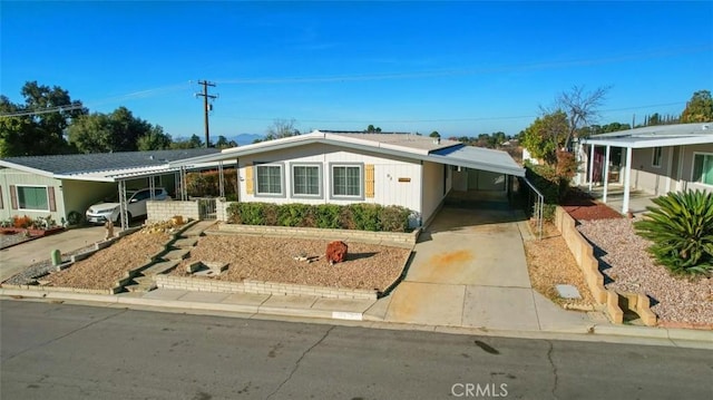 ranch-style home featuring a carport