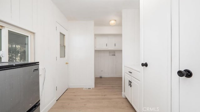 hallway featuring light wood-type flooring