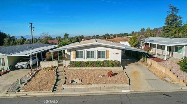 single story home featuring a carport