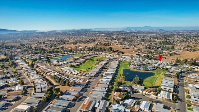 aerial view featuring a water and mountain view