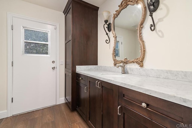 bathroom featuring wood-type flooring and vanity