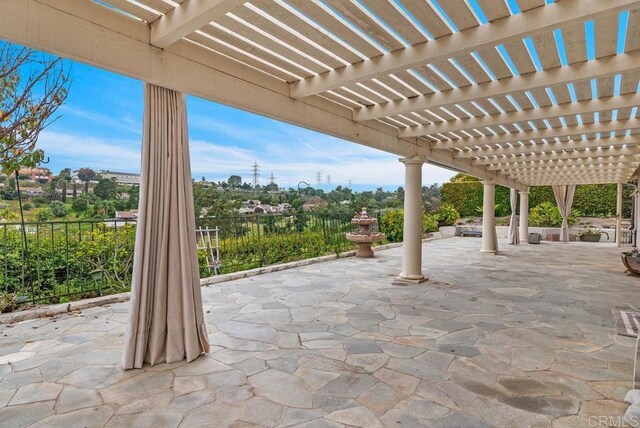 view of patio featuring a pergola