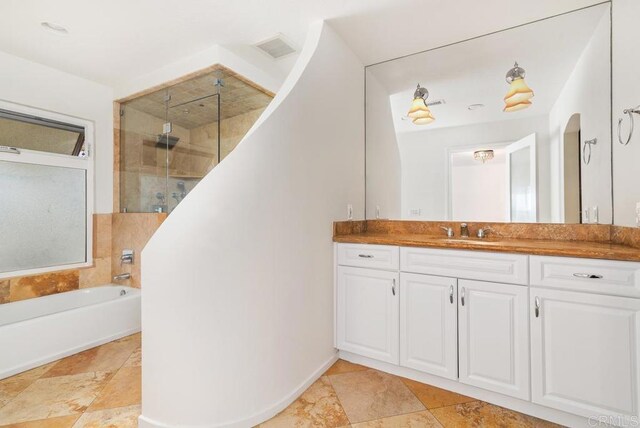 bathroom featuring vanity and plus walk in shower