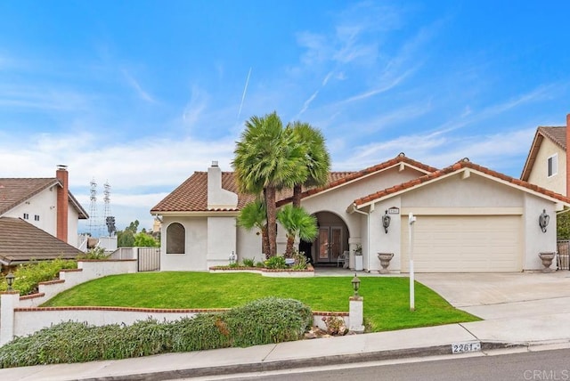 view of front of home featuring a front lawn and a garage