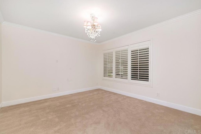 unfurnished room with light colored carpet, ornamental molding, and a chandelier