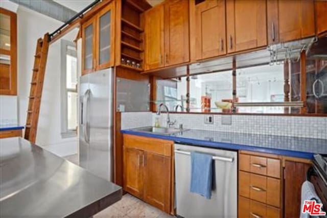 kitchen with sink and appliances with stainless steel finishes