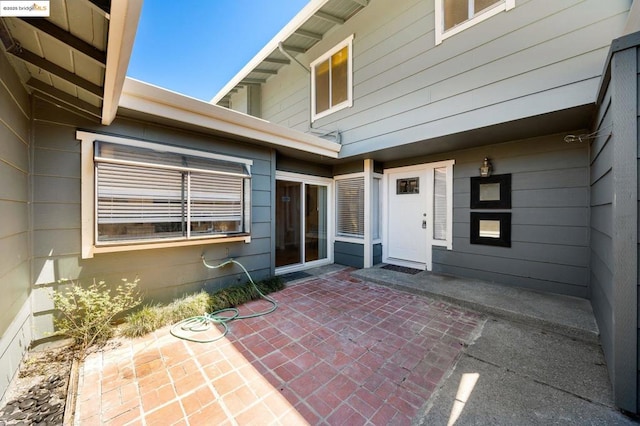 property entrance featuring a patio