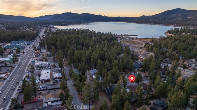 aerial view at dusk with a water and mountain view