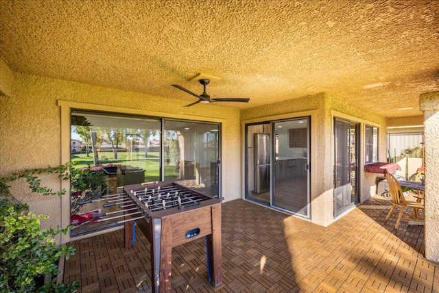 view of patio with ceiling fan