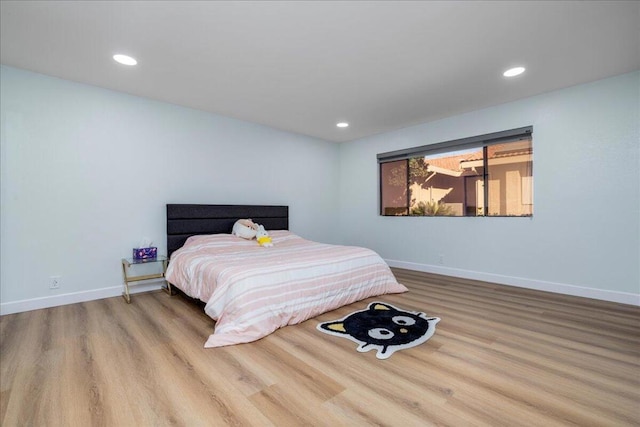 bedroom with light hardwood / wood-style flooring