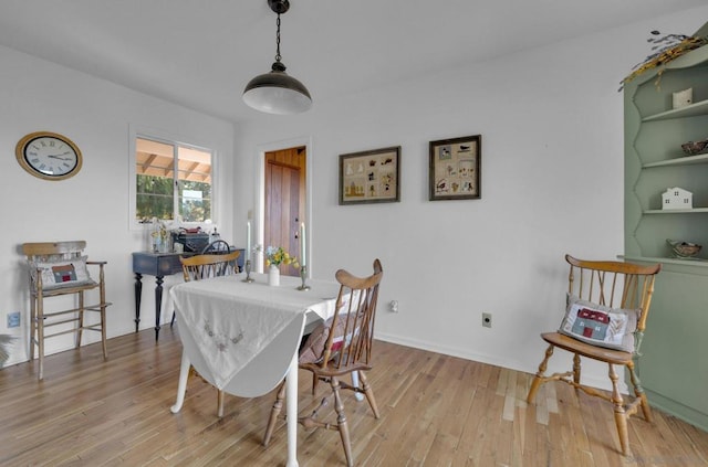 dining space featuring light hardwood / wood-style flooring