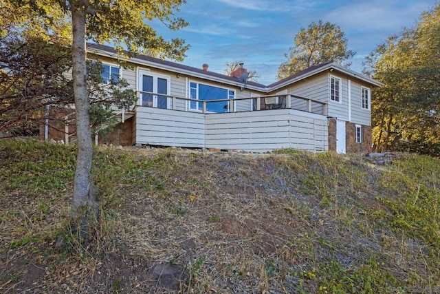 view of front of home with a wooden deck