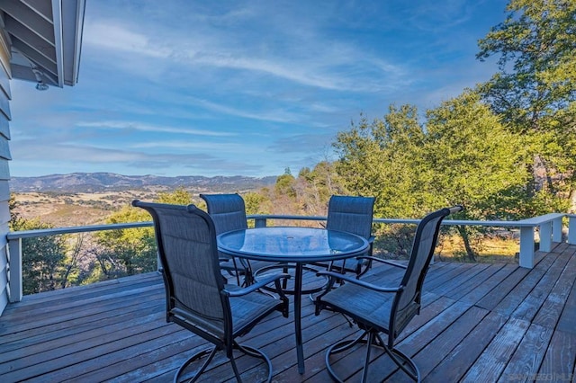 wooden deck featuring a mountain view