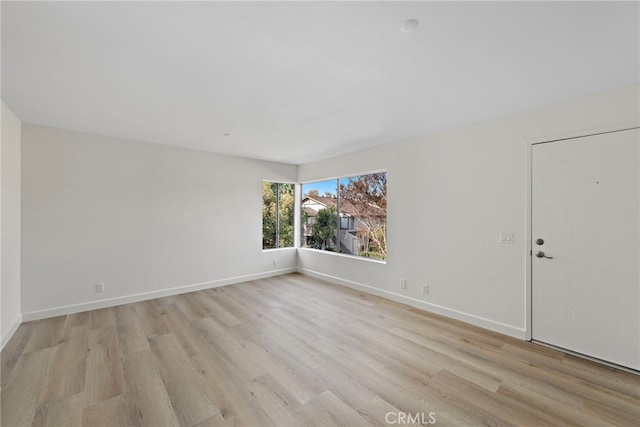 empty room with light wood-type flooring