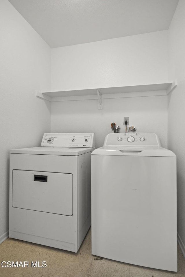 laundry area with washer and clothes dryer