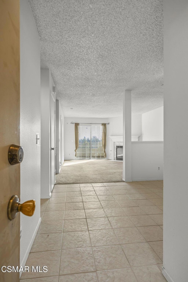 hall with light tile patterned flooring