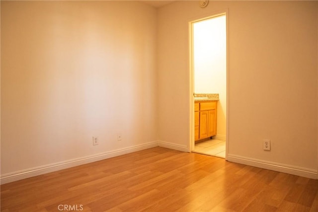 unfurnished room featuring light hardwood / wood-style flooring