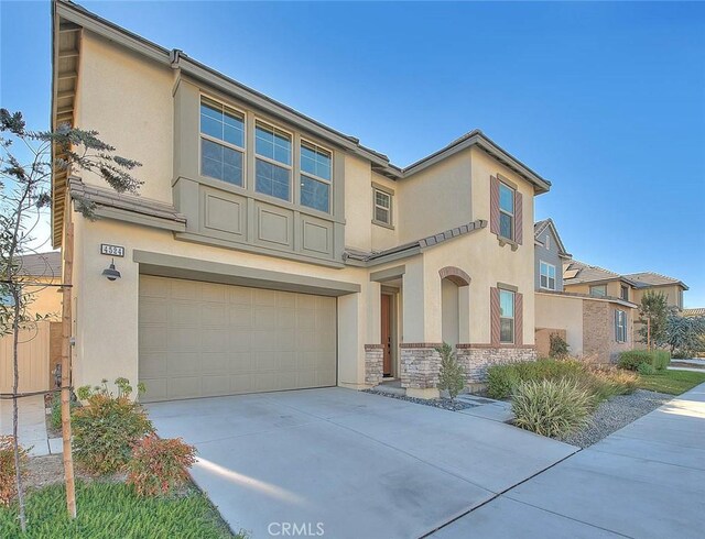 view of front of property with a garage