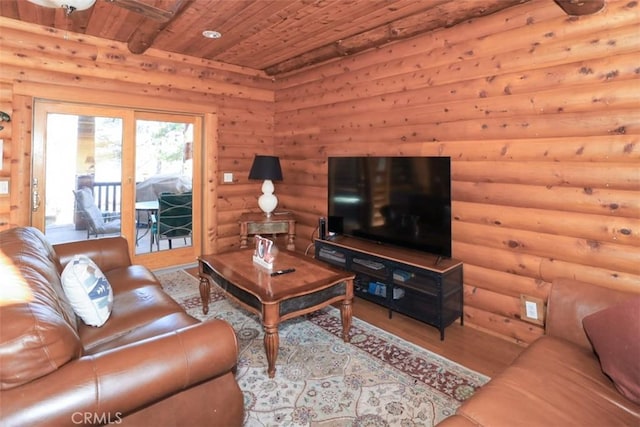 living room with wooden ceiling, light wood-type flooring, and log walls