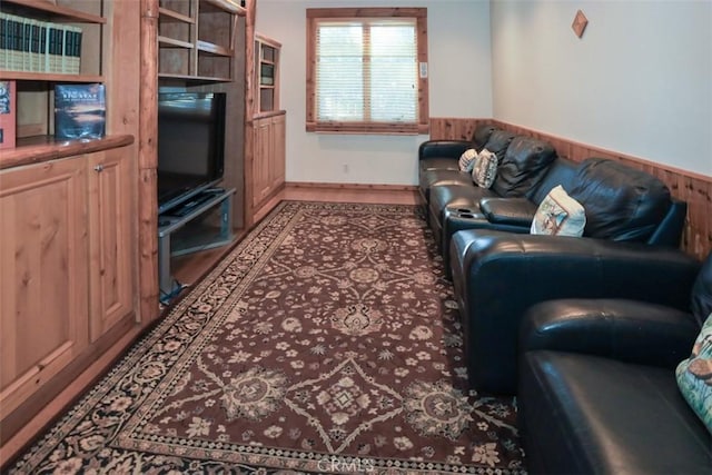 living room featuring wooden walls