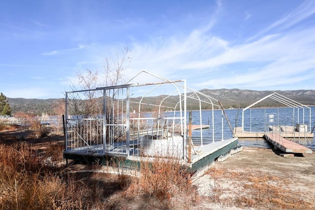 dock area featuring a water and mountain view