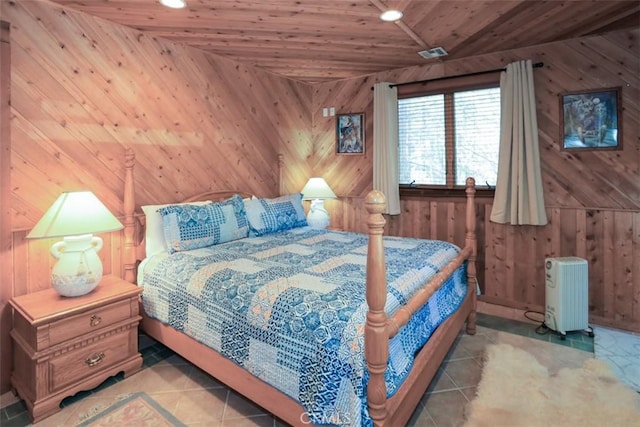 tiled bedroom featuring wooden ceiling and wood walls