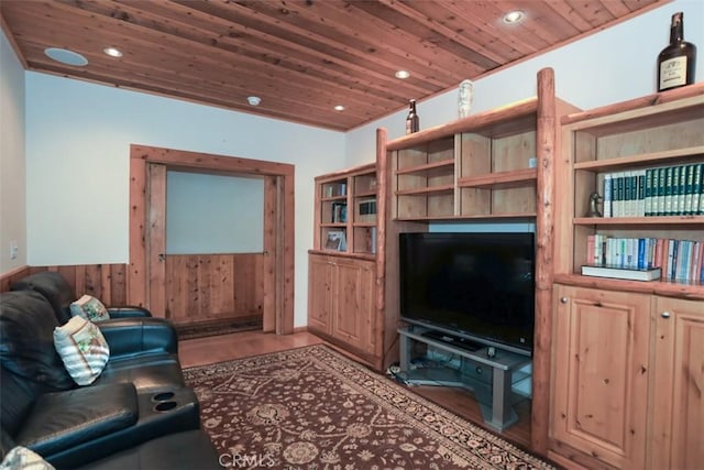 living room with wooden ceiling, hardwood / wood-style flooring, and wooden walls