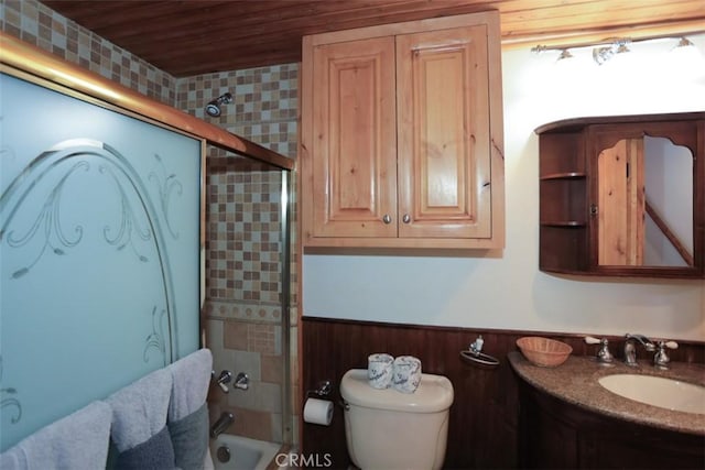 full bathroom with tiled shower / bath combo, vanity, toilet, wood walls, and wooden ceiling