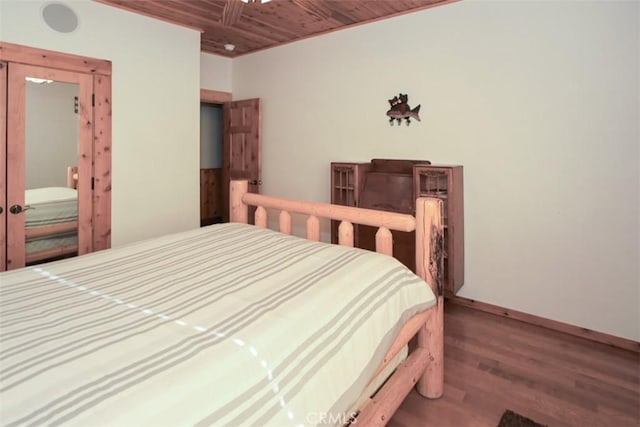 bedroom featuring wooden ceiling and wood-type flooring