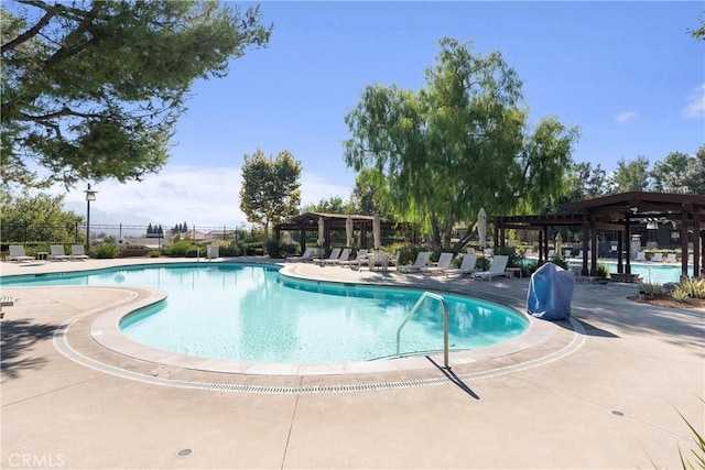 view of swimming pool with a patio area