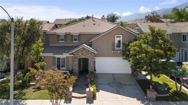 view of property with a garage and a mountain view