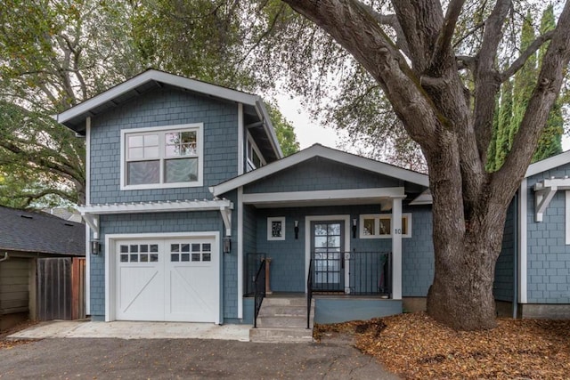 view of front of house featuring a garage and covered porch