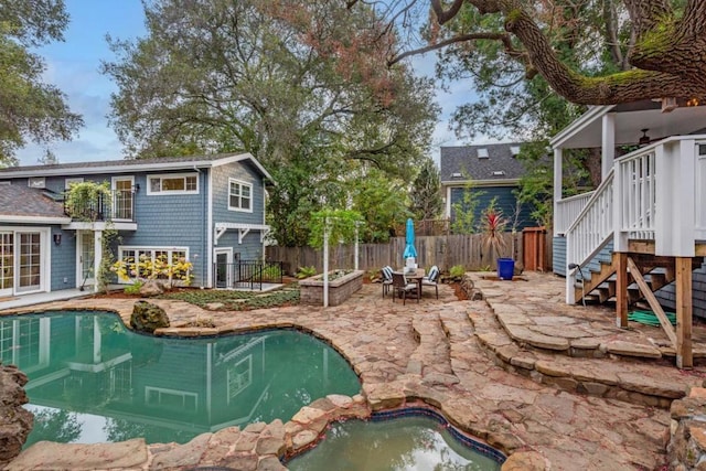 view of swimming pool with a patio