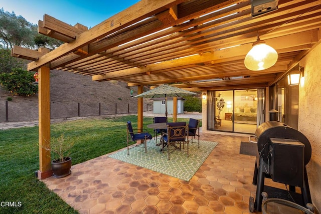 view of patio / terrace featuring a pergola and a storage shed