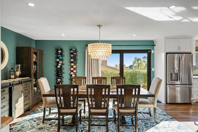 dining room featuring a chandelier and dark hardwood / wood-style floors