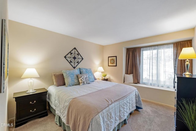 bedroom with light colored carpet