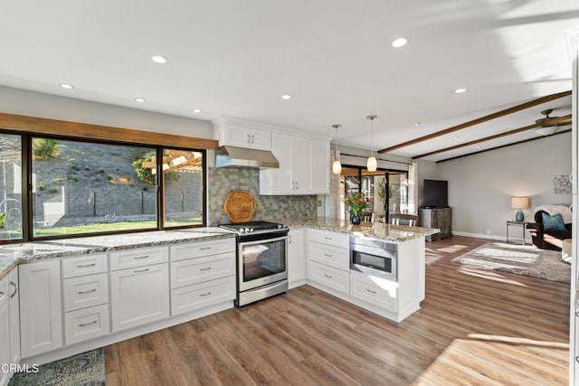 kitchen featuring stainless steel appliances, light hardwood / wood-style flooring, kitchen peninsula, pendant lighting, and white cabinets