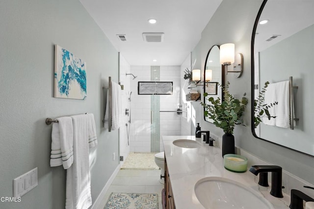 bathroom featuring tile patterned flooring, vanity, an enclosed shower, and toilet