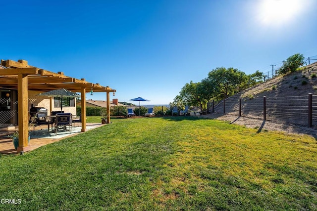 view of yard with a pergola and a patio