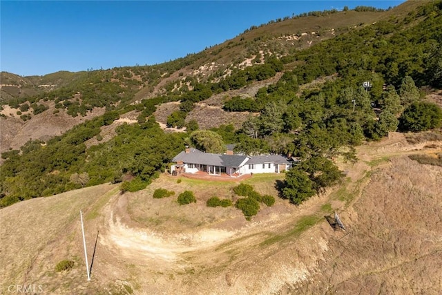 birds eye view of property with a mountain view