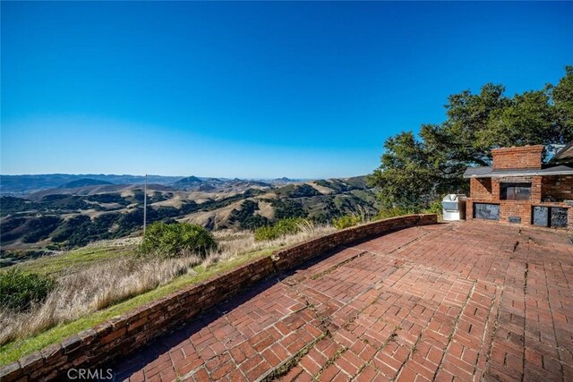 view of patio featuring a mountain view