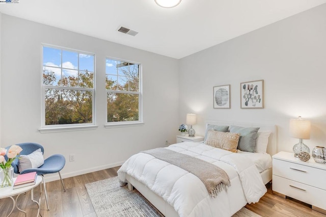 bedroom with light hardwood / wood-style flooring