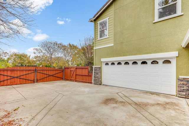 view of side of property featuring a garage