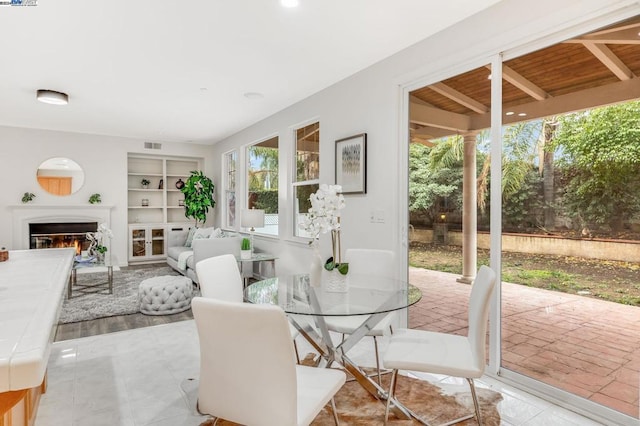 tiled dining area featuring built in features