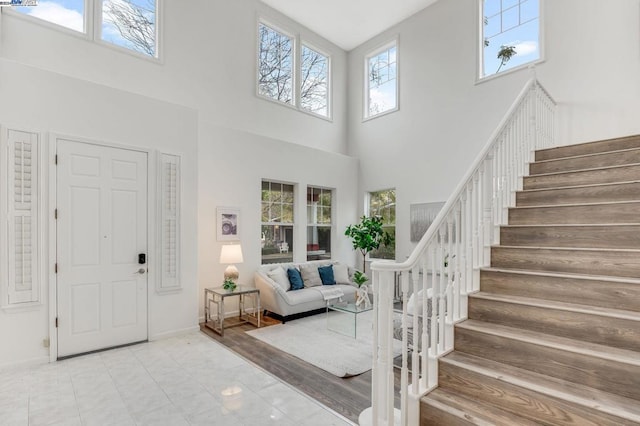 entrance foyer featuring a towering ceiling