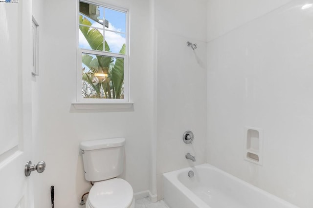 bathroom with shower / bath combination and toilet